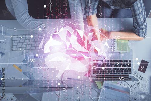 Double exposure of man and woman working together and human brain hologram drawing. Brainstorm concept. Computer background. Top View. © peshkova