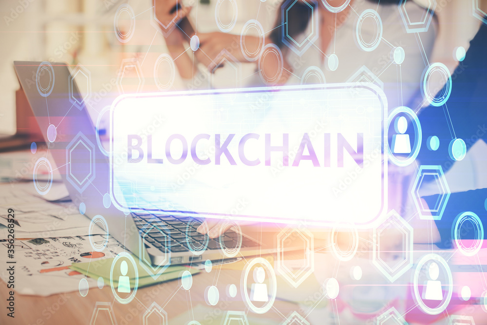 Double exposure of woman hands typing on computer and crypto market theme hologram drawing. Blockchain concept. Double exposure of woman hands typing on computer and crypto market theme hologram drawing. Blockchain concept.