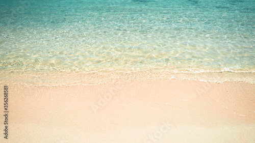 Turquoise water empty beach shore. Summertime backdrop. Space for text