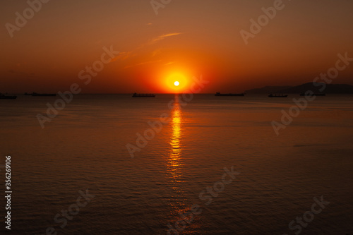 A sunset over a body of water © dimm86