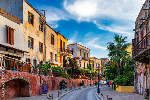 Fototapeta Naklejka Na Ścianę i Meble -  Street in the old town of Chania, Crete, Greece. Charming streets of Greek islands, Crete. Beautiful street in Chania, Crete island, Greece. Summer landscape. Chania old street of Crete island Greece.