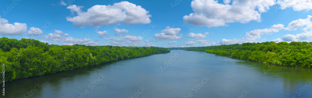 The Big Mississippi river panorama with blue sky and white clouds The Big Mississippi river panorama with blue sky and white clouds