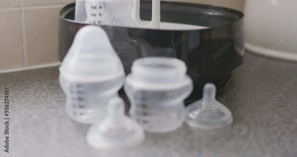 Close up of baby bottles and sterilizing equipment. Close up of baby bottles and sterilizing equipment.