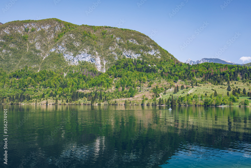 Lake Bohinj in Slovenia, beauty in nature. Colorful summer on the Bohinj lake in Triglav national park Slovenia, Alps, Europe. Mountain Lake bohinj in Julian Alps, Slovenia