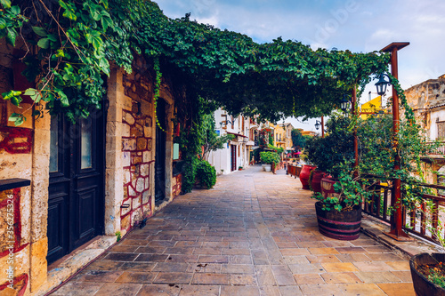 Fototapeta Naklejka Na Ścianę i Meble -  Street in the old town of Chania, Crete, Greece. Charming streets of Greek islands, Crete. Beautiful street in Chania, Crete island, Greece. Summer landscape. Chania old street of Crete island Greece.