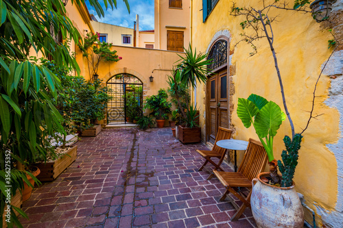 Fototapeta Naklejka Na Ścianę i Meble -  Street in the old town of Chania, Crete, Greece. Charming streets of Greek islands, Crete. Beautiful street in Chania, Crete island, Greece. Summer landscape. Chania old street of Crete island Greece.