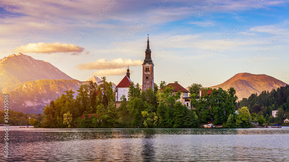 Lake Bled Slovenia. Beautiful mountain lake with small Pilgrimage Church. Most famous Slovenian lake and island Bled with Pilgrimage Church of the Assumption of Maria. Bled, Slovenia, Europe.