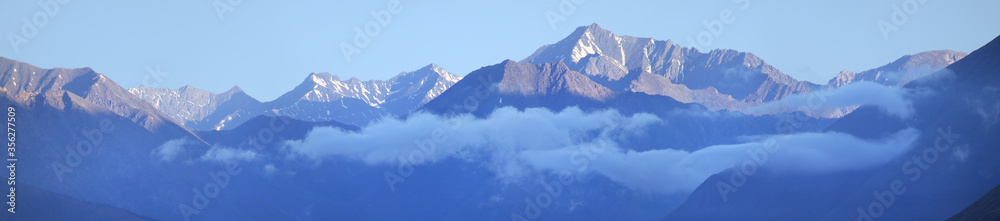 Fototapeta Panoramic view of the mountain range, blue haze