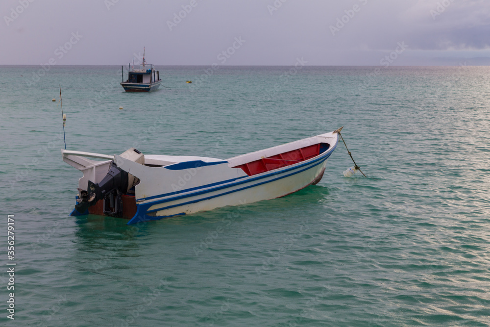 Fishing boat in the sea with anchored in the sea Fishing boat in the sea with anchored in the sea