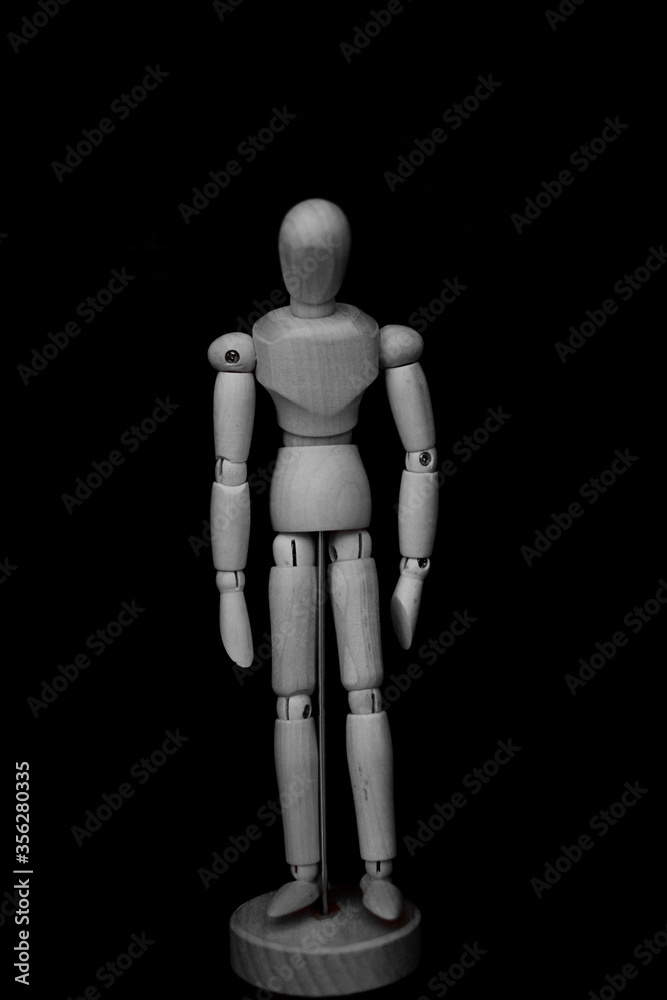 wooden mannequin standing on black background with feeling dowm posture wooden mannequin standing on black background with feeling dowm posture