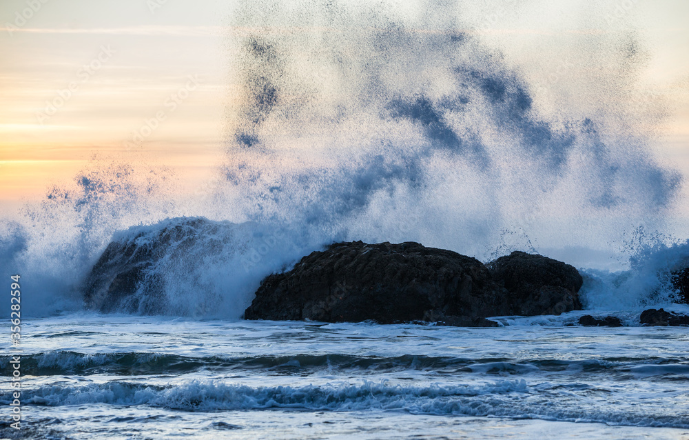 Waves crashing against rocks on the Oregon Coast