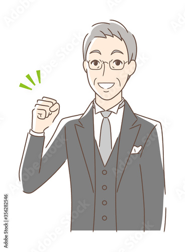 ガッツポーズする男性