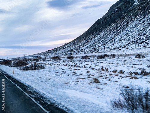 Iceland, travel on the road, beautiful mountain, snow,  and road.