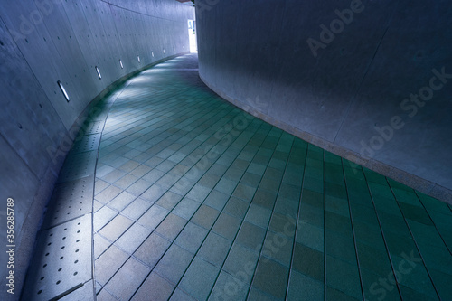 Empty modern pedestrian walkway in the dark