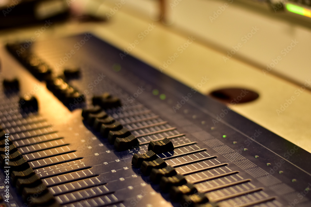 Closeup Analog sound mixer with selected focus. Professional audio mixing console broadcasting. Closeup Analog sound mixer with selected focus. Professional audio mixing console broadcasting.