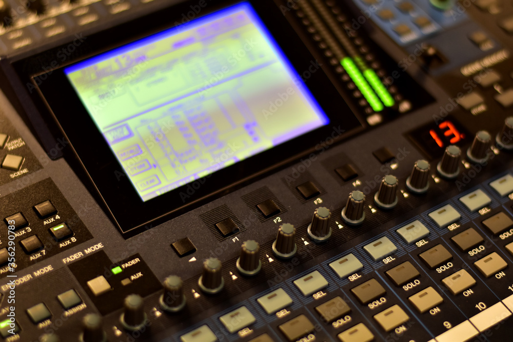 Closeup Analog sound mixer with selected focus. Professional audio mixing console broadcasting.