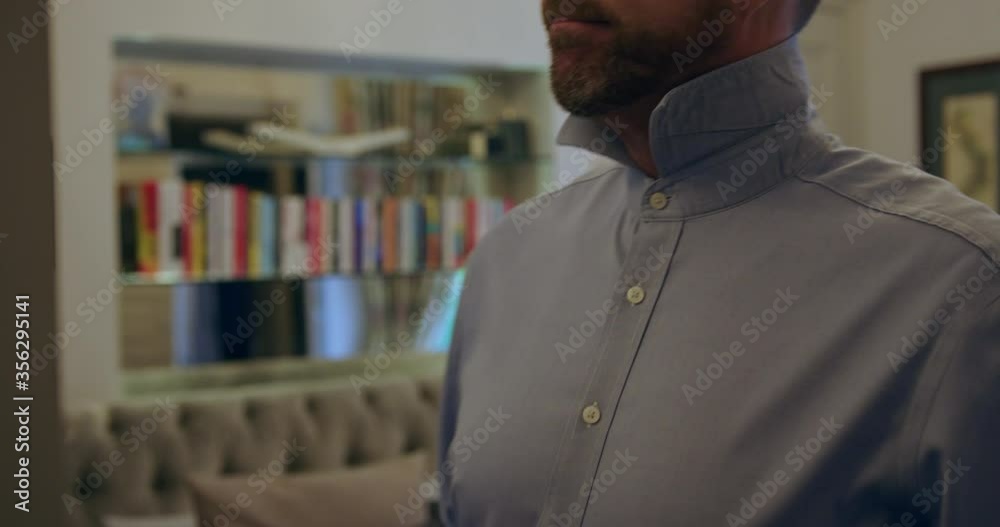 Close up of man getting dressed in the morning, putting on a red tie. Close up of man getting dressed in the morning, putting on a red tie.