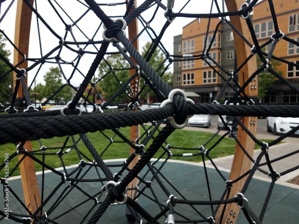 black metal rope climbing structure at playground