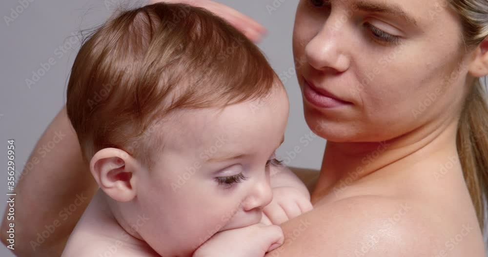 SLO MO CU Young mother kissing baby son (6-11 months) SLO MO CU Young mother kissing baby son (6-11 months)