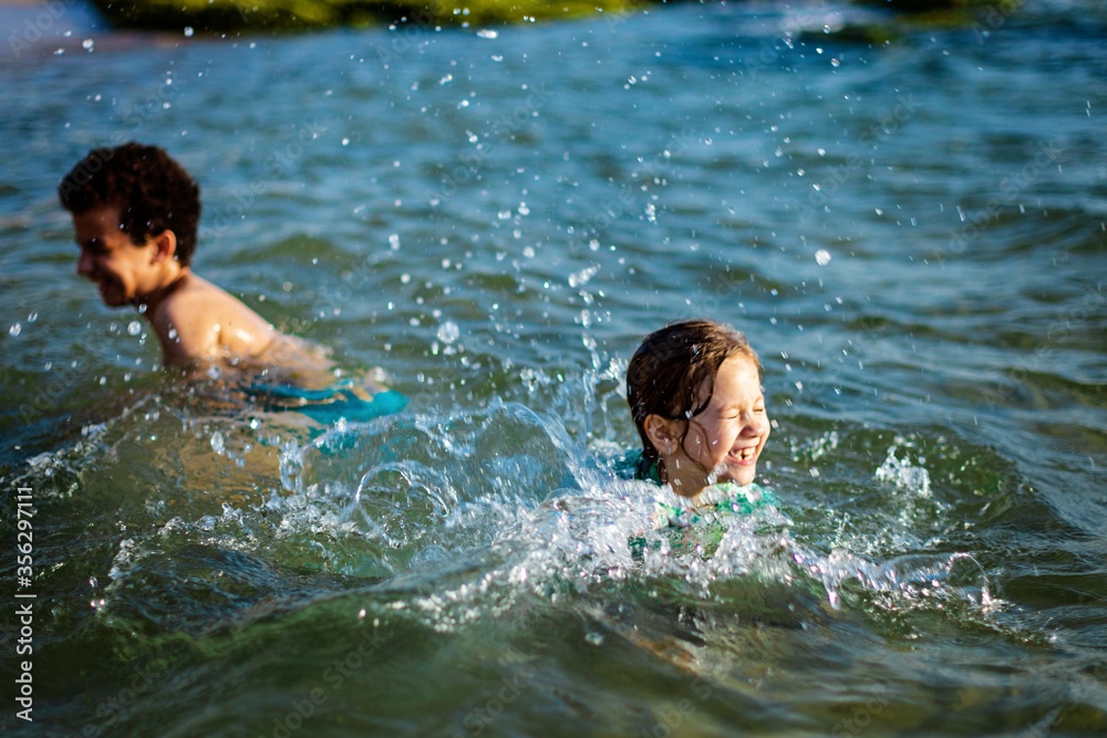 funny childrenfunny children playing in the waterplaying in the water. High quality photo