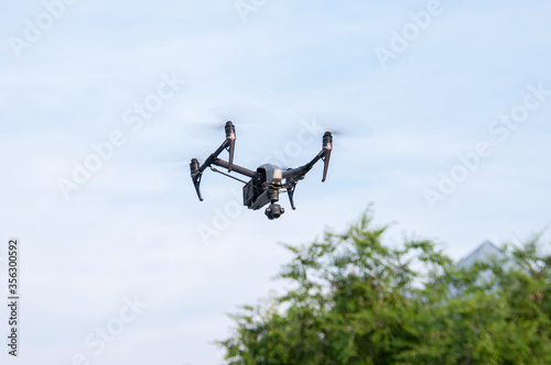 China, Heihe, July 2019: a drone in the air against a blue sky
