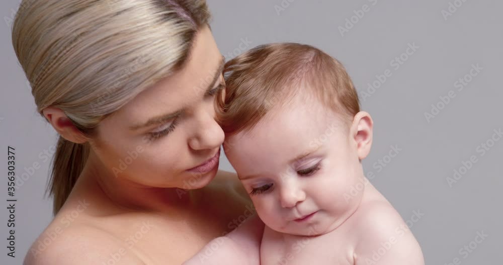 SLO MO CU Young mother kissing baby son (6-11 months) SLO MO CU Young mother kissing baby son (6-11 months)