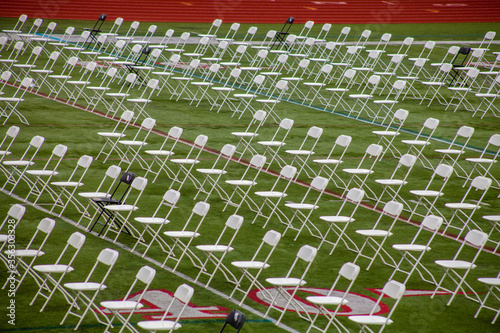 Rows of folding chairs at commencement