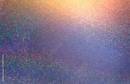 Golden shine on shimmer blue lilac ombre texture. Festive background.
