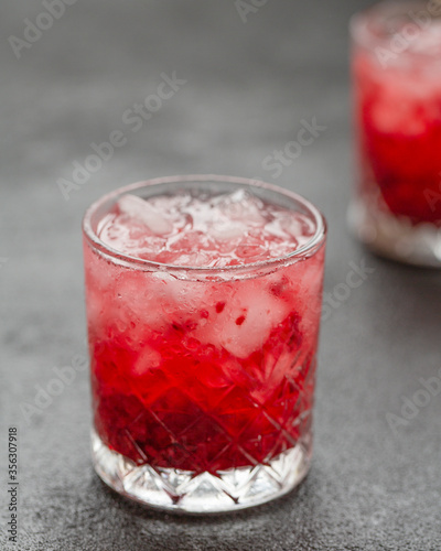 Wallpaper Mural Cold alcoholic cocktail with cherry and ice cubes. Cherry Cocktail with Vodka. Selective focus Torontodigital.ca
