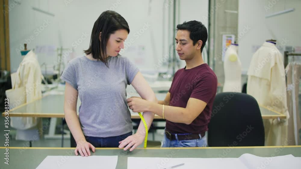 MS Professor supervising fashion design students in workshop at University of the Arts / London, England, United Kingdom MS Professor supervising fashion design students in workshop at University of the Arts / London, England, United Kingdom