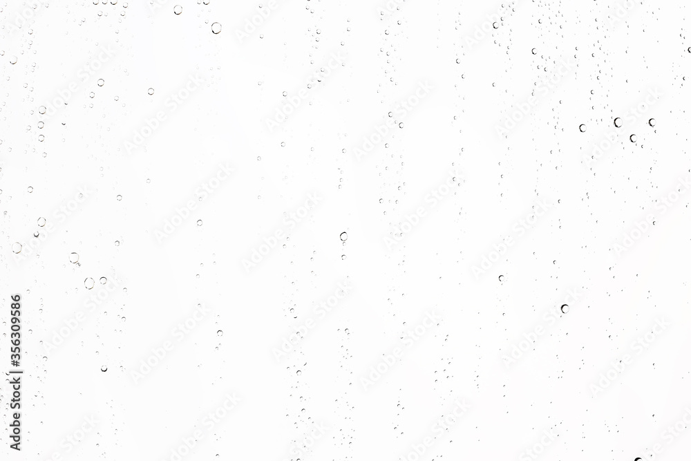 white isolated background water drops on the glass / wet window glass with splashes and drops of water and lime, texture autumn background white isolated background water drops on the glass / wet window glass with splashes and drops of water and lime, texture autumn background