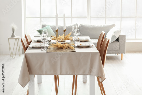Served table in modern dining room
