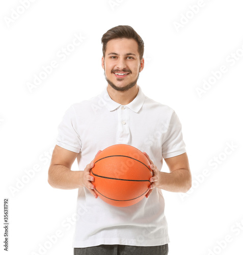 Sporty young man with ball on white background