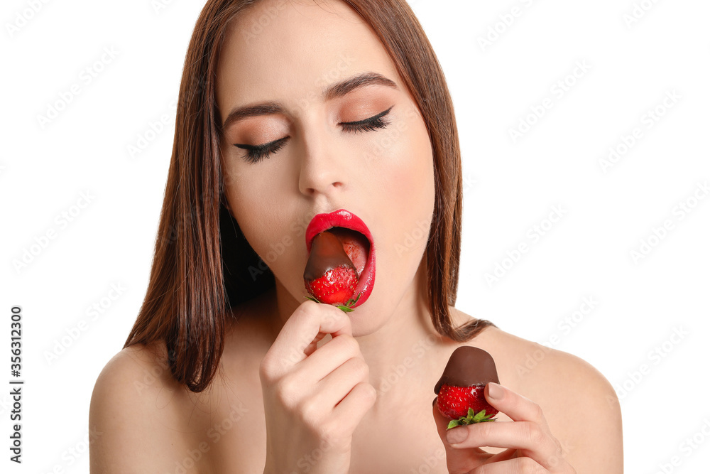 Sexy young woman with strawberry on white background Sexy young woman with strawberry on white background