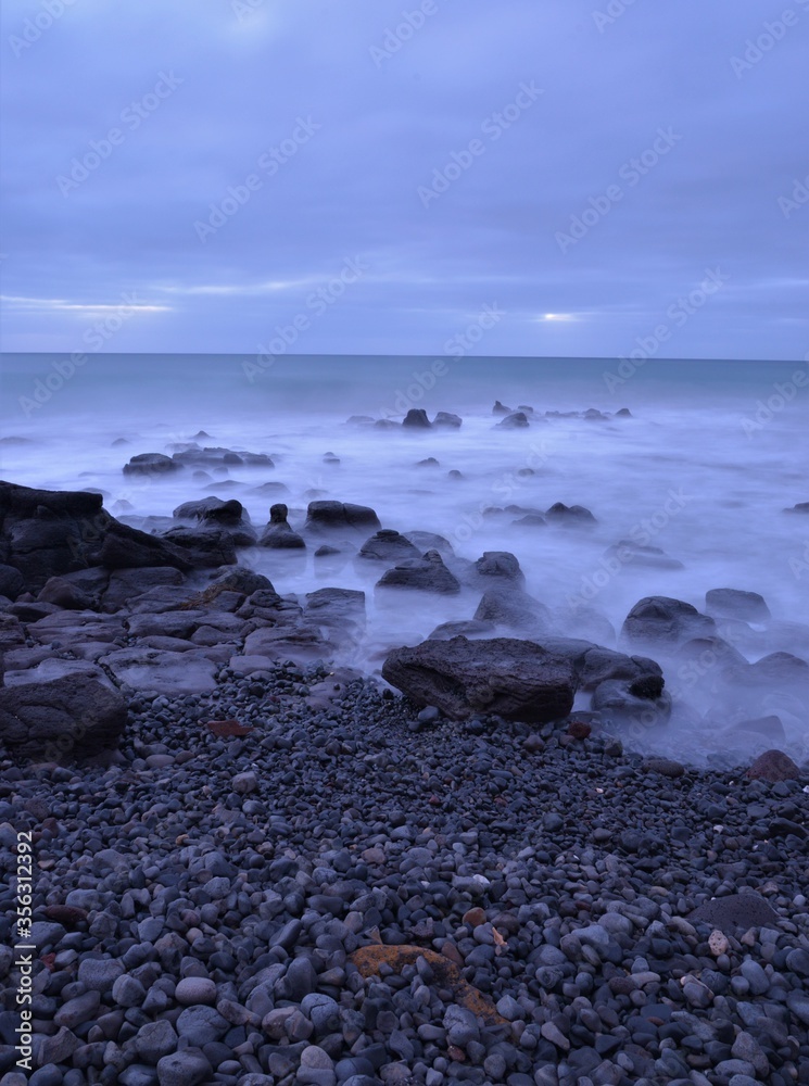 Rocks on beach sunrise Pivot Beach Portland Victoria Australia