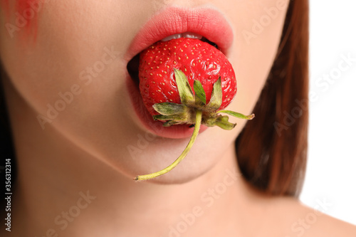 Sexy young woman with straw...