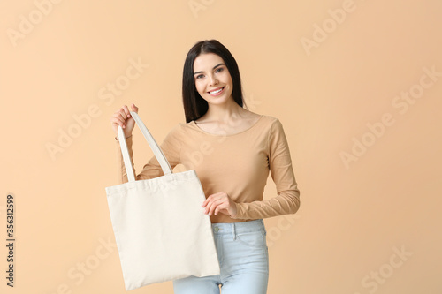 Young woman with eco bag on...