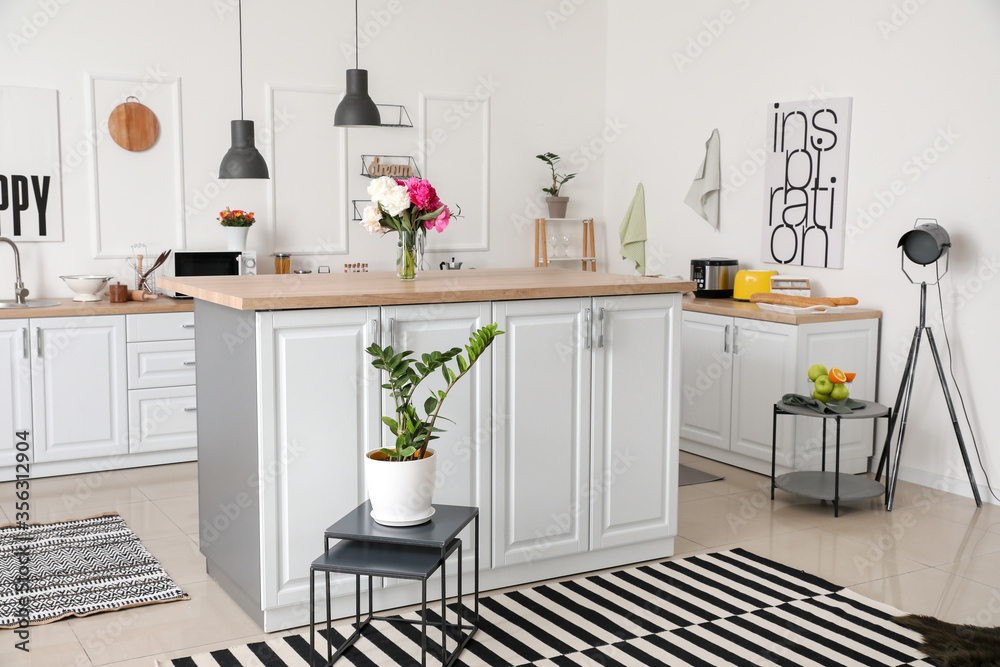 Interior of modern kitchen with stylish table