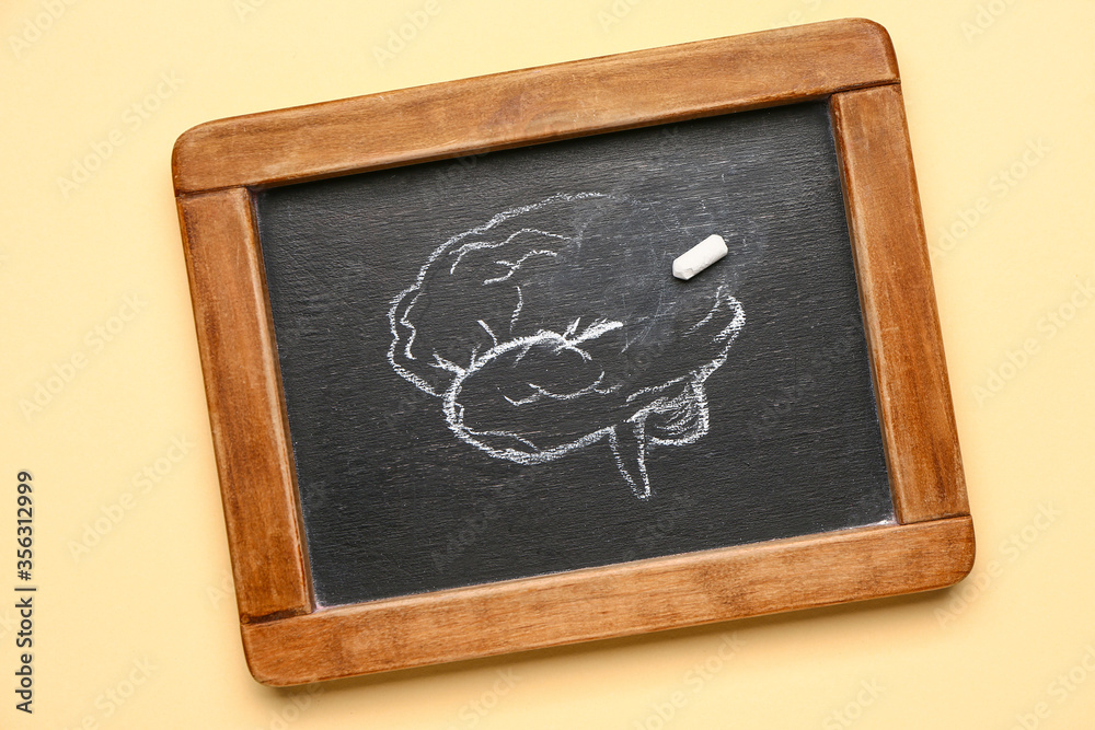 Chalkboard with drawing of human brain on color background. Concept of dementia Chalkboard with drawing of human brain on color background. Concept of dementia