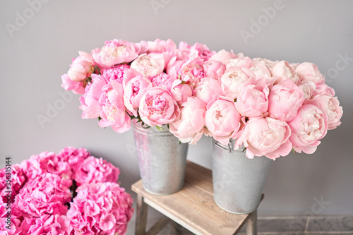 pinks peonies miss America in a metal vase. Beautiful peony flower for catalog or online store. Floral shop concept . Beautiful fresh cut bouquet. Flowers delivery