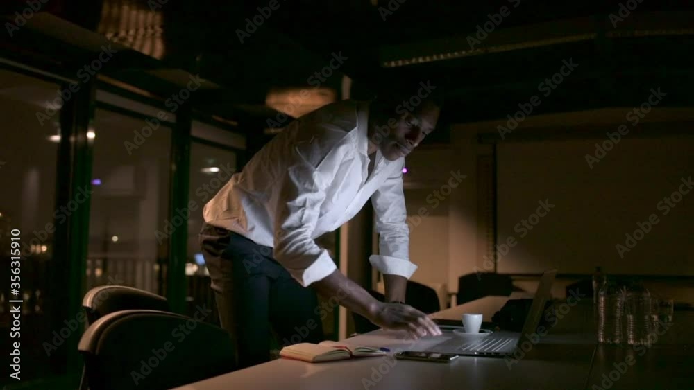 MS Businessman working in office at night / Milan, Italy MS Businessman working in office at night / Milan, Italy