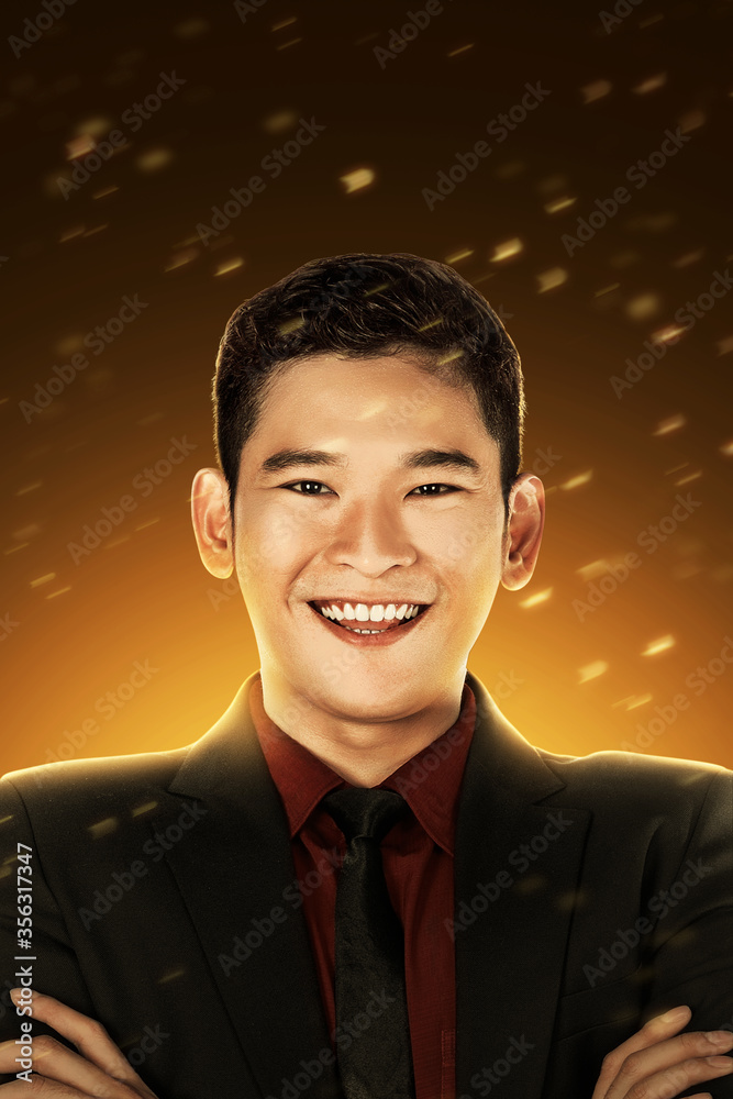 Φωτογραφία Asian businessman with crossed arms standing