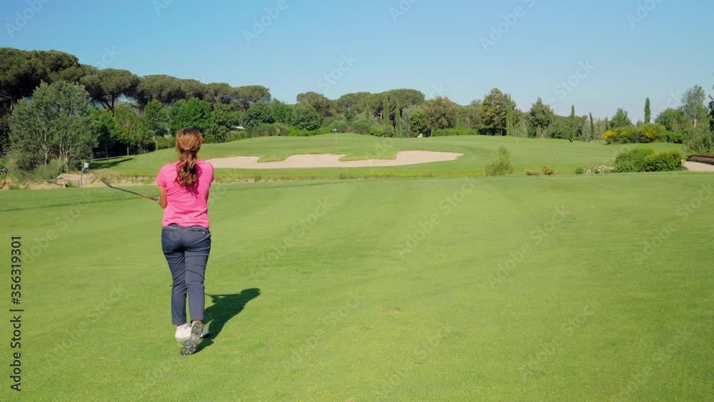 WS Woman playing golf on sunny day / Prato, Florence, Italy WS Woman playing golf on sunny day / Prato, Florence, Italy