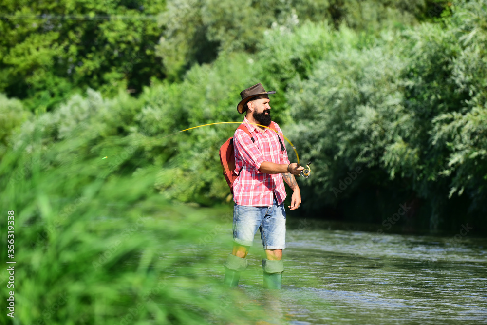 Fly fishing is most renowned as a method for catching trout and salmon. Concepts of successful fishing. Summer holidays and people concept. Fly fishing is most renowned as a method for catching trout and salmon. Concepts of successful fishing. Summer holidays and people concept.