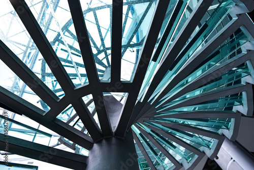 Metal spiral staircase with glass steps
