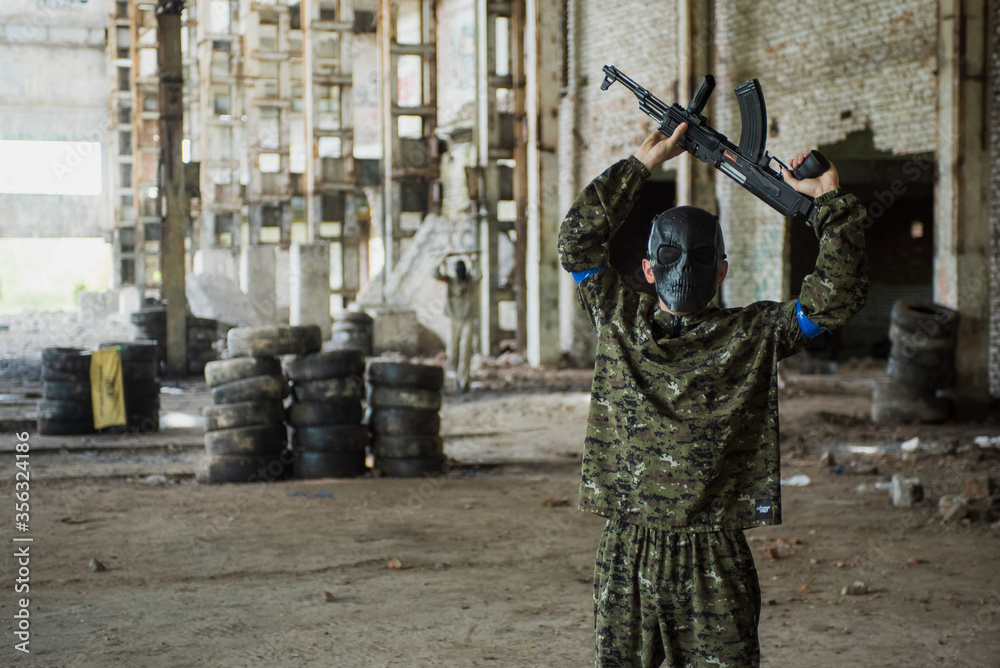 June 7, 2020, Ukraine, the city of Lviv. young boys and girls with an AK-47 rifle play airsoft. Active rest, sports June 7, 2020, Ukraine, the city of Lviv. young boys and girls with an AK-47 rifle play airsoft. Active rest, sports