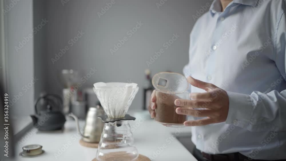 CU Man preparing coffee in kitchen / Denmark CU Man preparing coffee in kitchen / Denmark