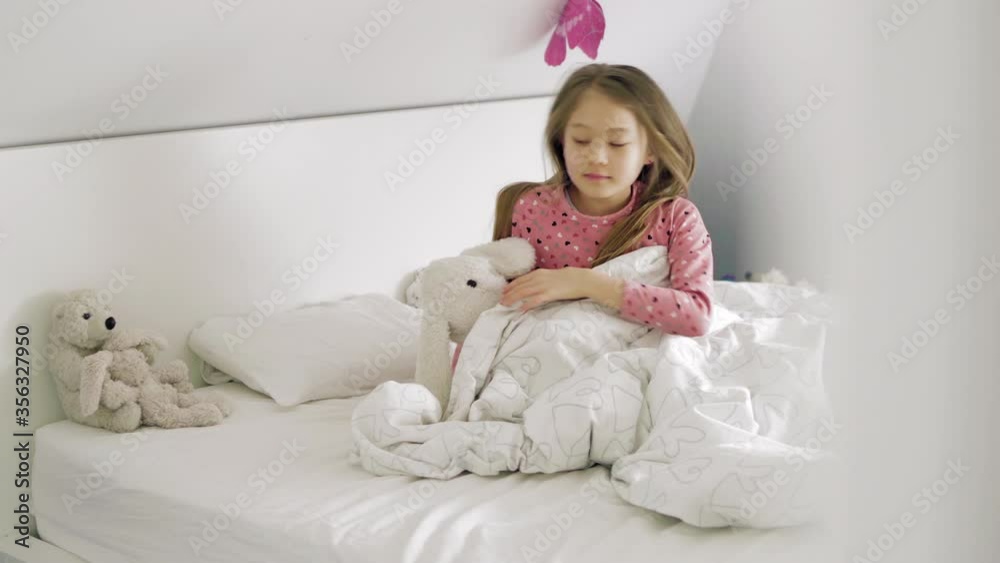 MS Girl (8-9) waking up and getting dressed in bedroom / Denmark MS Girl (8-9) waking up and getting dressed in bedroom / Denmark