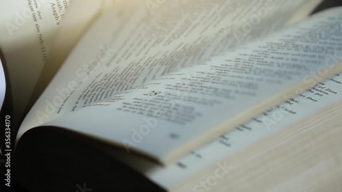 Slow motion of turning pages of bible book. photo