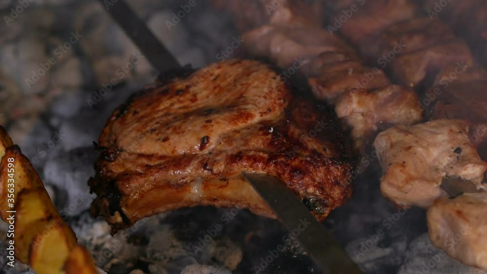 Tasty grilled food. Pork meat prepared on fire. Street food. Barbecue party. Tasty grilled food. Pork meat prepared on fire. Street food. Barbecue party.